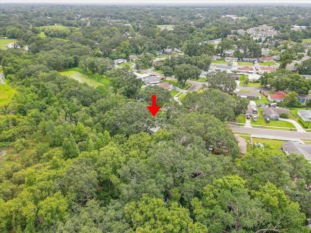 320 Pheasant Cir, Brandon, FL 33510 - aerial view of property's location with a heavily wooded area and nearby suburban area