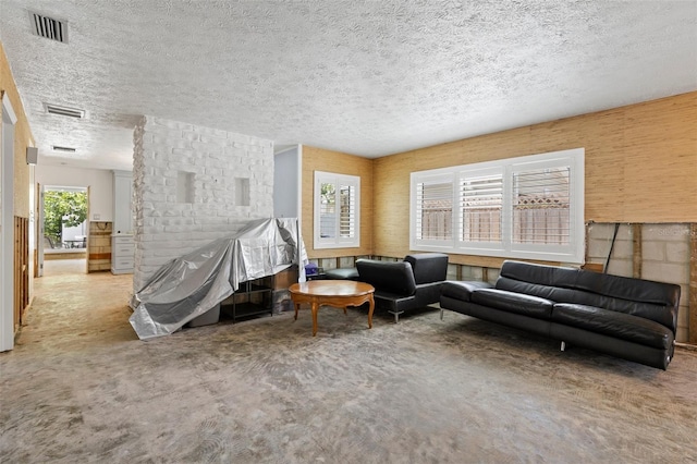 163 Barbados Ave, Tampa, FL 33606 - carpeted living room with a textured ceiling