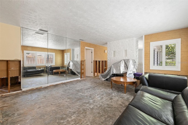 163 Barbados Ave, Tampa, FL 33606 - carpeted living room featuring a textured ceiling