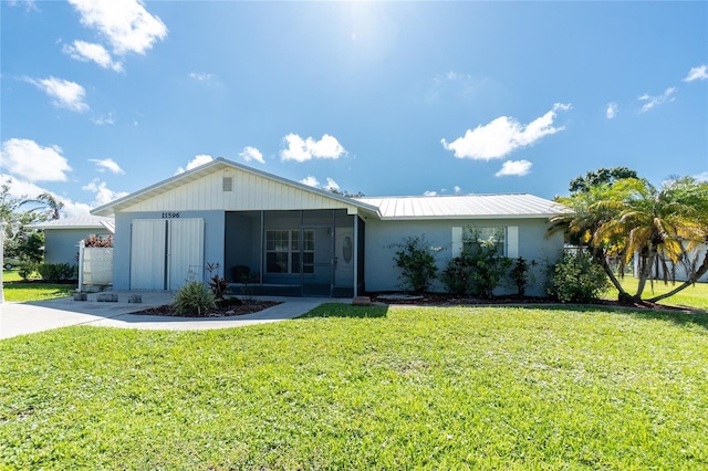11596 SW Lemon Ave, Arcadia, FL 34269 - ranch-style house featuring a front lawn, stucco siding, and a metal roof