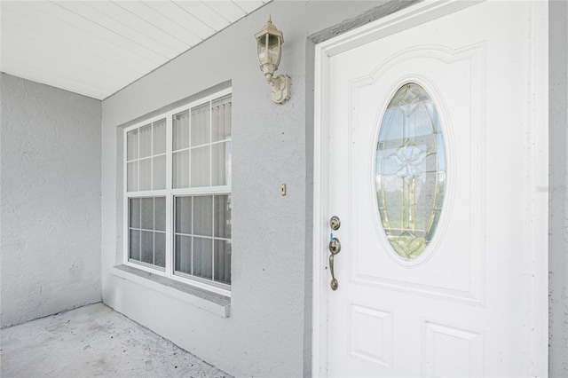 11596 SW Lemon Ave, Arcadia, FL 34269 - doorway to property featuring stucco siding