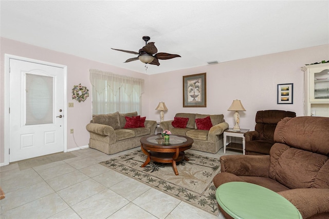 11596 SW Lemon Ave, Arcadia, FL 34269 - living room with a ceiling fan and light tile patterned floors