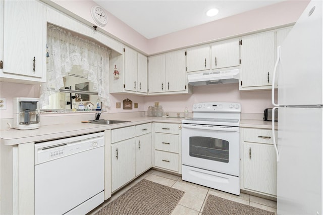 11596 SW Lemon Ave, Arcadia, FL 34269 - kitchen featuring white appliances, under cabinet range hood, light countertops, and light tile patterned floors
