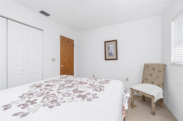 11596 SW Lemon Ave, Arcadia, FL 34269 - carpeted bedroom with a closet and multiple windows