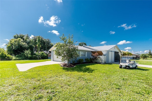 11596 SW Lemon Ave, Arcadia, FL 34269 - view of front of home with a front lawn, a metal roof, and concrete driveway