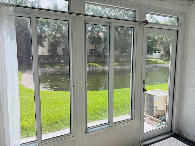 1212 Kennewick Ct, Wesley Chapel, FL 33543 - doorway featuring a water view and a textured wall