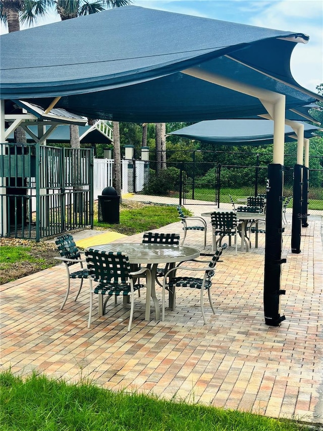 1212 Kennewick Ct, Wesley Chapel, FL 33543 - view of community with outdoor dining space and a patio area