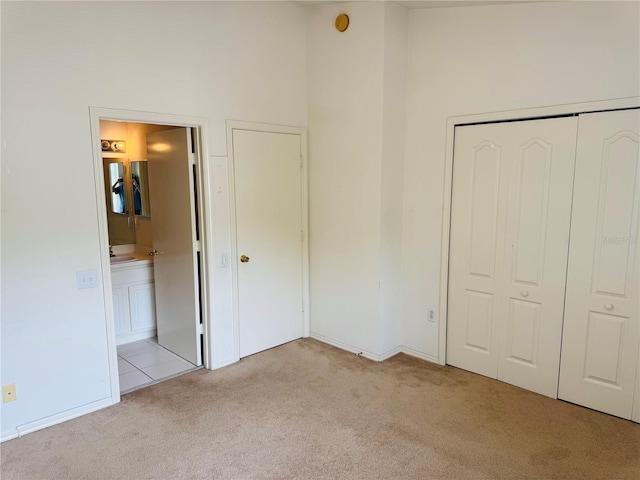 1212 Kennewick Ct, Wesley Chapel, FL 33543 - unfurnished bedroom with light colored carpet, connected bathroom, and a closet