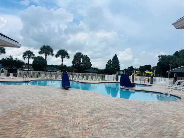 1212 Kennewick Ct, Wesley Chapel, FL 33543 - community pool with a patio area