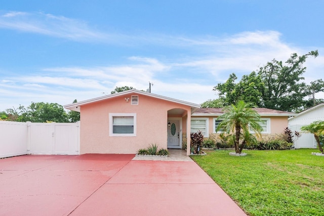 217 Bryan Rd, Brandon, FL 33511 - view of front of home with stucco siding, a gate, and stone siding