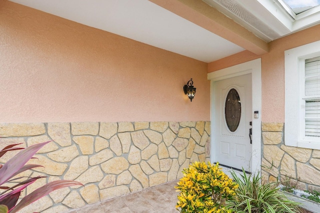 217 Bryan Rd, Brandon, FL 33511 - doorway to property featuring stone siding and stucco siding