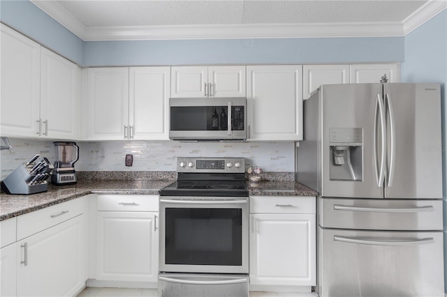 217 Bryan Rd, Brandon, FL 33511 - kitchen with appliances with stainless steel finishes, crown molding, white cabinets, decorative backsplash, and a textured ceiling