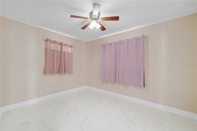 217 Bryan Rd, Brandon, FL 33511 - unfurnished room featuring ceiling fan and marble look tile flooring