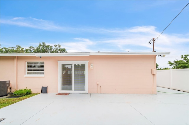 217 Bryan Rd, Brandon, FL 33511 - rear view of property with a patio and concrete block siding