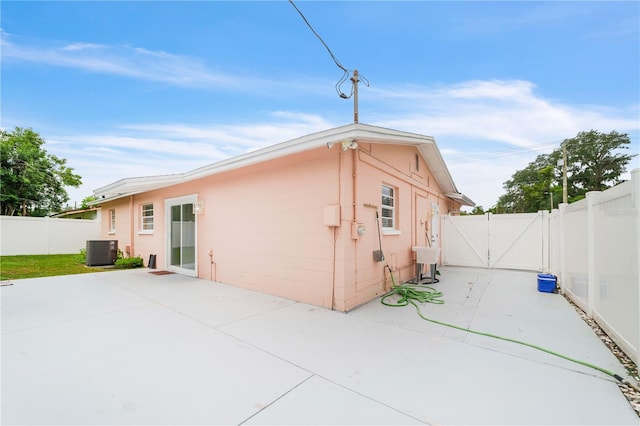 217 Bryan Rd, Brandon, FL 33511 - rear view of property with a gate, a patio area, and a fenced backyard