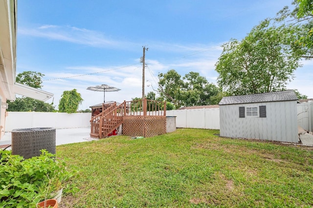 217 Bryan Rd, Brandon, FL 33511 - fenced backyard featuring stairway, a shed, a patio, and a wooden deck