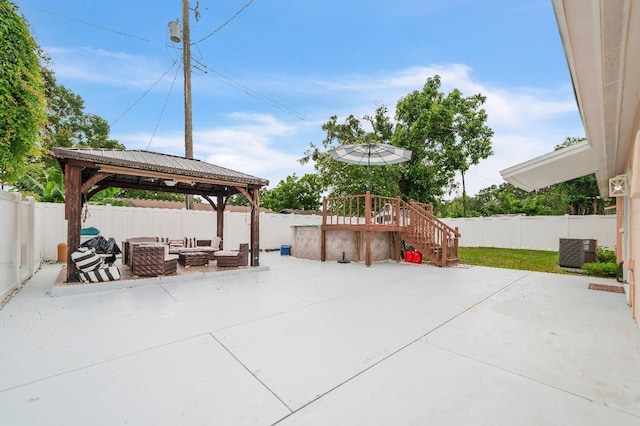 217 Bryan Rd, Brandon, FL 33511 - fenced backyard with an outdoor living space, a gazebo, and a patio