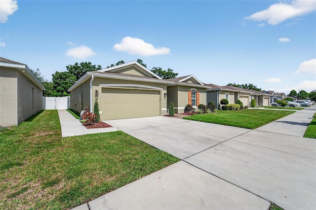 10409 Candleberry Woods Ln, Gibsonton, FL 33534 - ranch-style house featuring a garage, driveway, and stucco siding