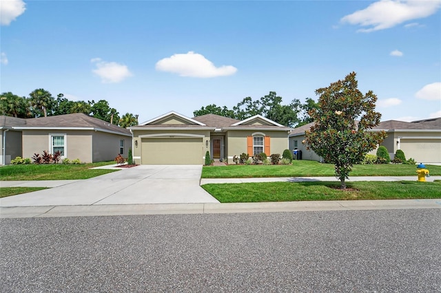 10409 Candleberry Woods Ln, Gibsonton, FL 33534 - ranch-style home featuring concrete driveway, a front yard, a garage, and stucco siding