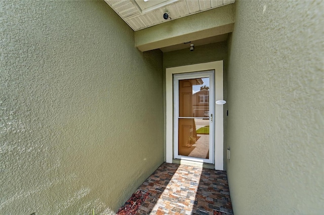 10409 Candleberry Woods Ln, Gibsonton, FL 33534 - view of exterior entry featuring stucco siding