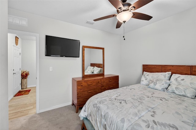 10409 Candleberry Woods Ln, Gibsonton, FL 33534 - carpeted bedroom with baseboards and a ceiling fan