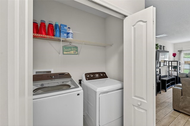 10409 Candleberry Woods Ln, Gibsonton, FL 33534 - laundry area with independent washer and dryer and wood tiled floors
