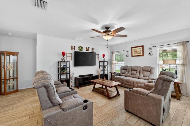 10409 Candleberry Woods Ln, Gibsonton, FL 33534 - living room with a ceiling fan and light wood-type flooring