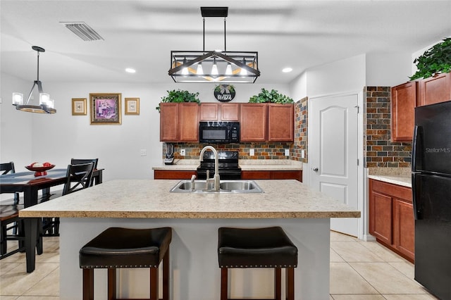 10409 Candleberry Woods Ln, Gibsonton, FL 33534 - kitchen with black appliances, tasteful backsplash, light tile patterned flooring, light countertops, and recessed lighting