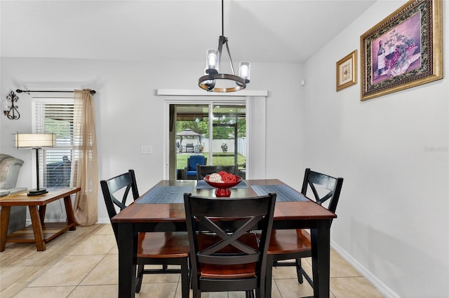 10409 Candleberry Woods Ln, Gibsonton, FL 33534 - dining area featuring a chandelier and light tile patterned flooring