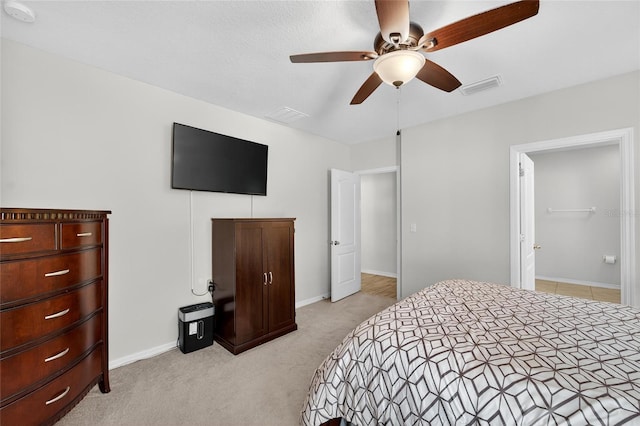 10409 Candleberry Woods Ln, Gibsonton, FL 33534 - bedroom with light colored carpet and ceiling fan