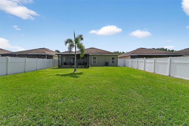 10409 Candleberry Woods Ln, Gibsonton, FL 33534 - rear view of property featuring a fenced backyard and a sunroom