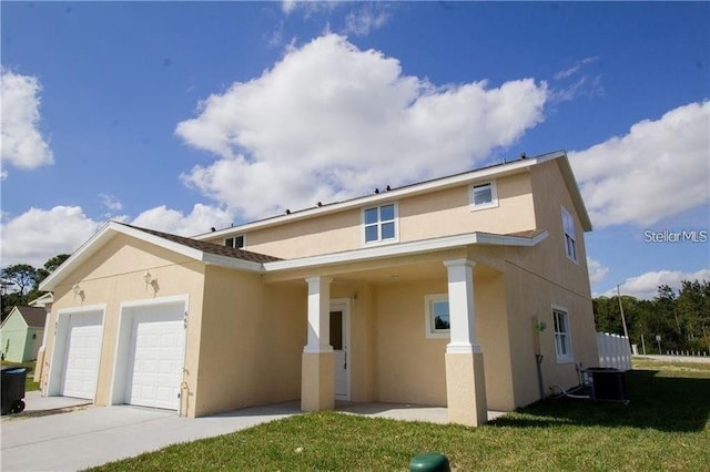 669 Lake Shore Pkwy, Davenport, FL 33896 - view of front of home with stucco siding, an attached garage, concrete driveway, and a front yard