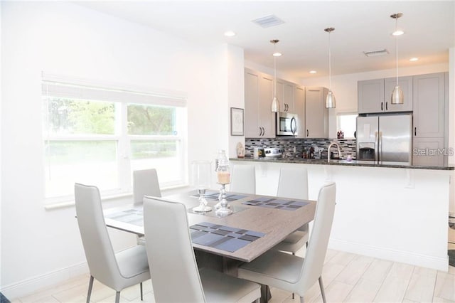 669 Lake Shore Pkwy, Davenport, FL 33896 - dining area with recessed lighting and baseboards