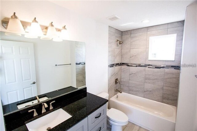 669 Lake Shore Pkwy, Davenport, FL 33896 - bathroom with vanity and washtub / shower combination