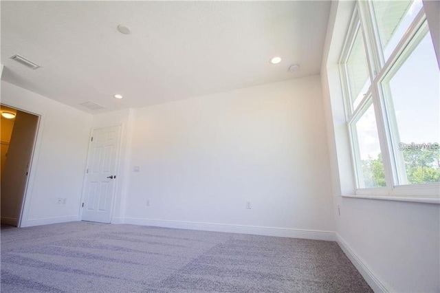 669 Lake Shore Pkwy, Davenport, FL 33896 - unfurnished room featuring light colored carpet and recessed lighting