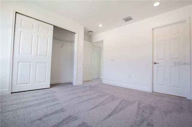 669 Lake Shore Pkwy, Davenport, FL 33896 - unfurnished bedroom with carpet floors, recessed lighting, and a closet