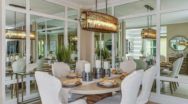 4704 Isonzo Way, Wesley Chapel, FL 33543 - dining space featuring a chandelier and crown molding