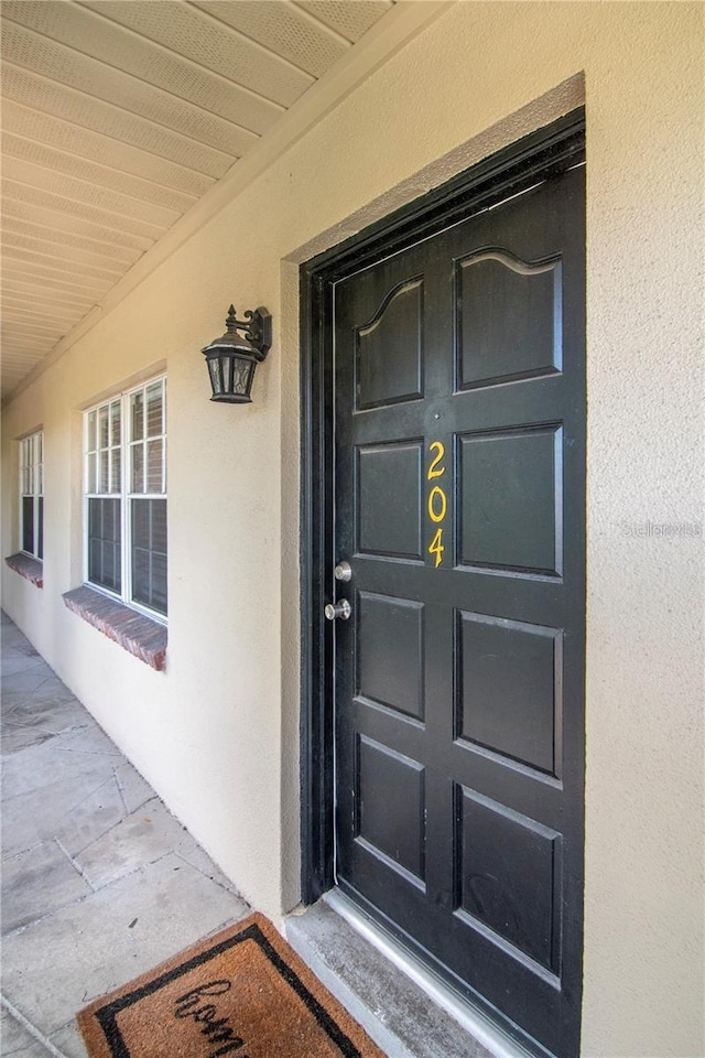 208 Danube Ave Unit 204, Tampa, FL 33606 - entrance to property featuring stucco siding