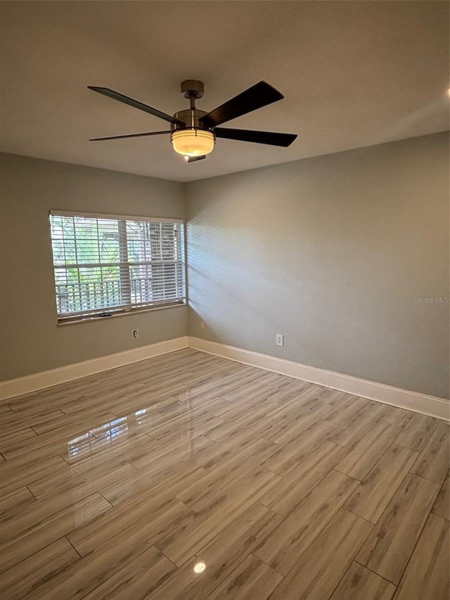 208 Danube Ave Unit 204, Tampa, FL 33606 - empty room with wood finished floors and ceiling fan