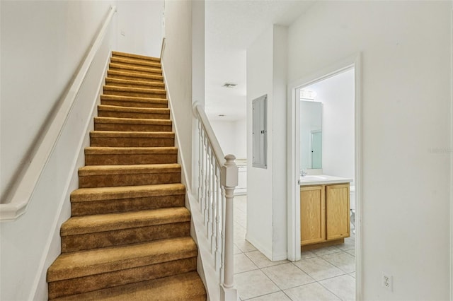 1713 Retreat Cir, Clermont, FL 34714 - stairs with tile patterned floors and electric panel