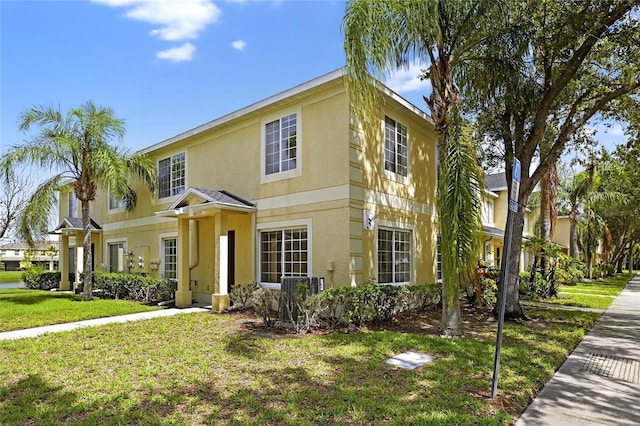 10737 Keys Gate Dr, Riverview, FL 33579 - view of front of property with stucco siding and a front yard