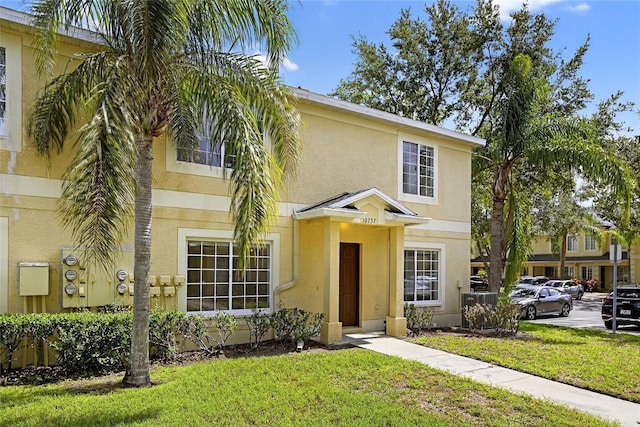 10737 Keys Gate Dr, Riverview, FL 33579 - view of front of home featuring stucco siding and a front lawn