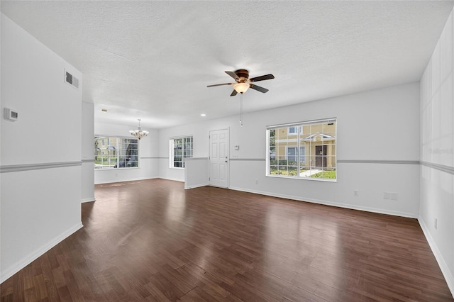 10737 Keys Gate Dr, Riverview, FL 33579 - unfurnished living room featuring a chandelier, a ceiling fan, wood finished floors, and a textured ceiling