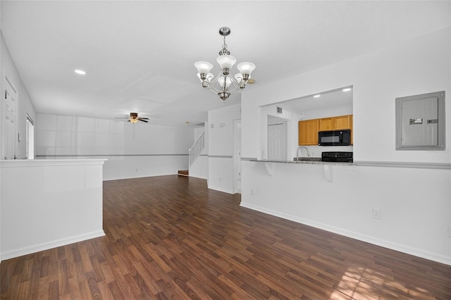 10737 Keys Gate Dr, Riverview, FL 33579 - unfurnished living room featuring electric panel, a chandelier, ceiling fan, wood finished floors, and recessed lighting