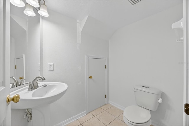 10737 Keys Gate Dr, Riverview, FL 33579 - bathroom with tile patterned floors and lofted ceiling
