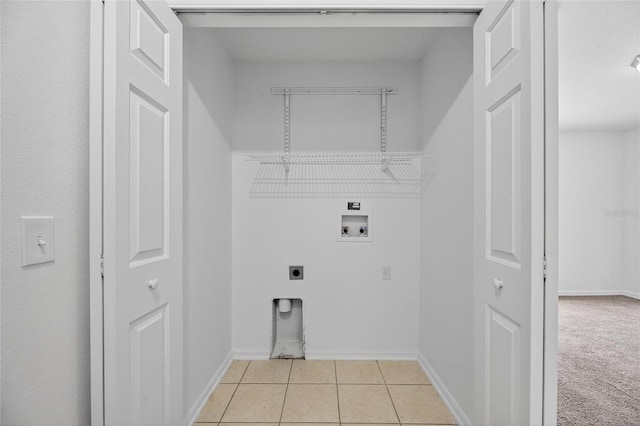 10737 Keys Gate Dr, Riverview, FL 33579 - laundry area featuring washer hookup, electric dryer hookup, and light tile patterned flooring