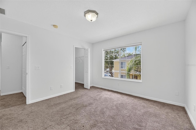 10737 Keys Gate Dr, Riverview, FL 33579 - unfurnished bedroom with carpet floors and a spacious closet