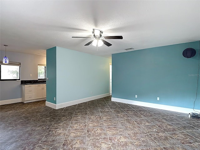 11718 Raintree Village Blvd Unit C, Temple Terrace, FL 33617 - spare room with ceiling fan and a textured ceiling