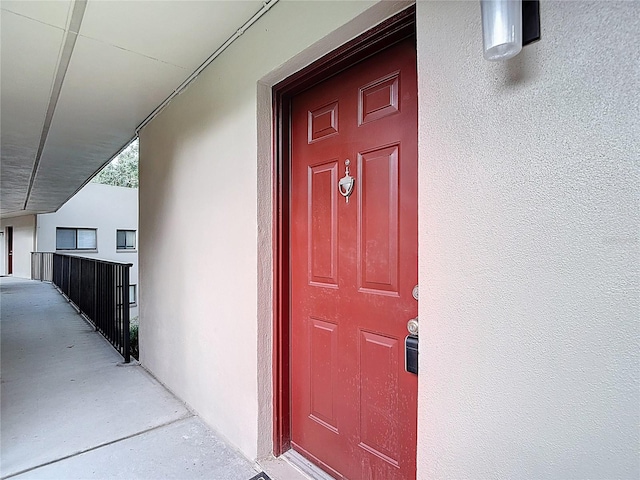 11718 Raintree Village Blvd Unit C, Temple Terrace, FL 33617 - property entrance with stucco siding