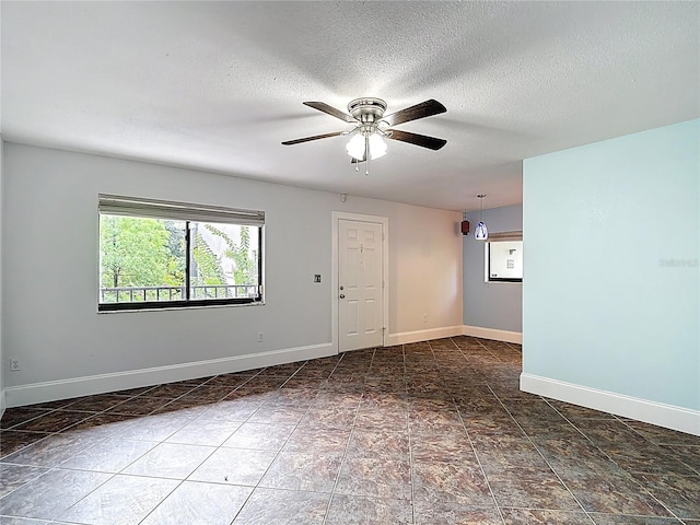 11718 Raintree Village Blvd Unit C, Temple Terrace, FL 33617 - spare room with a ceiling fan and a textured ceiling
